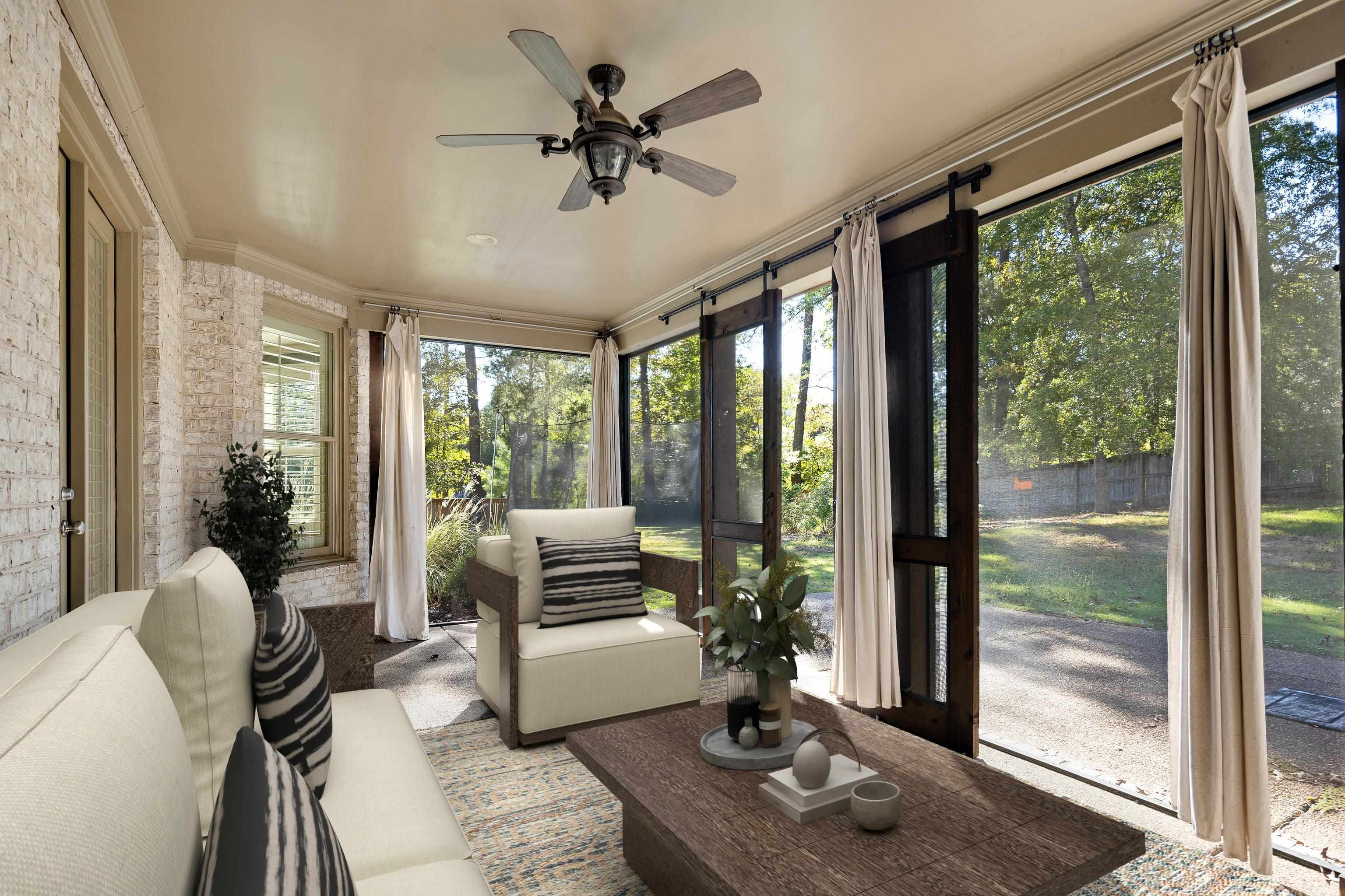 250 Ridgewood Drive Piperton, TN 38017 - Photo 29 of 36 a living room with furniture and a floor to ceiling window