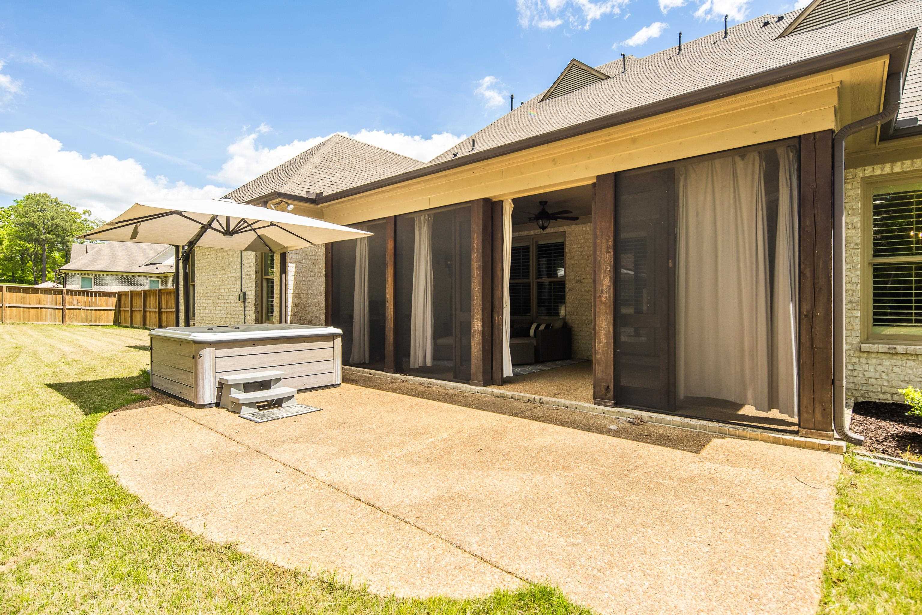 250 Ridgewood Drive Piperton, TN 38017 - Photo 30 of 36 a front view of a house with large windows