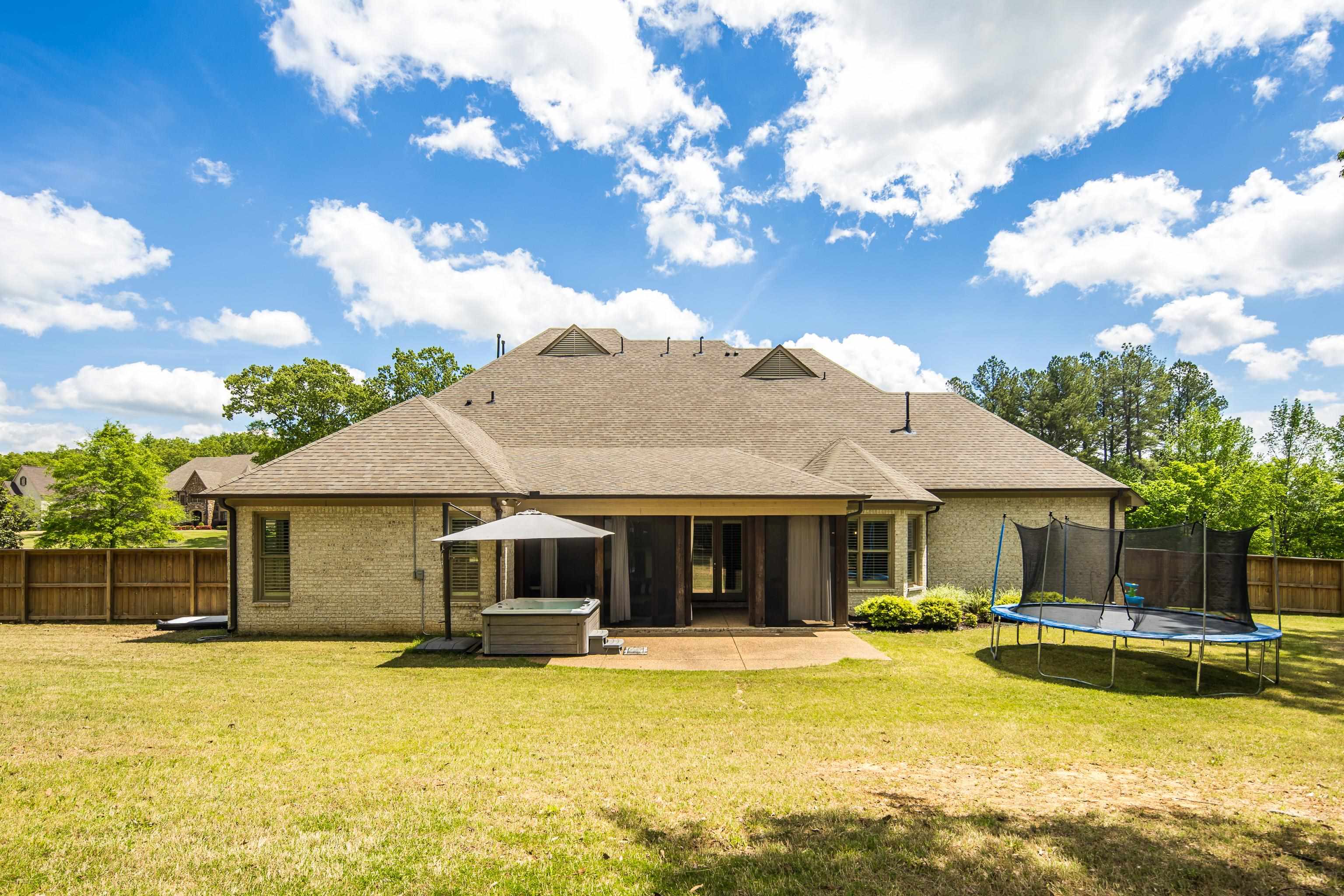 250 Ridgewood Drive Piperton, TN 38017 - Photo 34 of 36 a front view of a house with swimming pool having outdoor seating