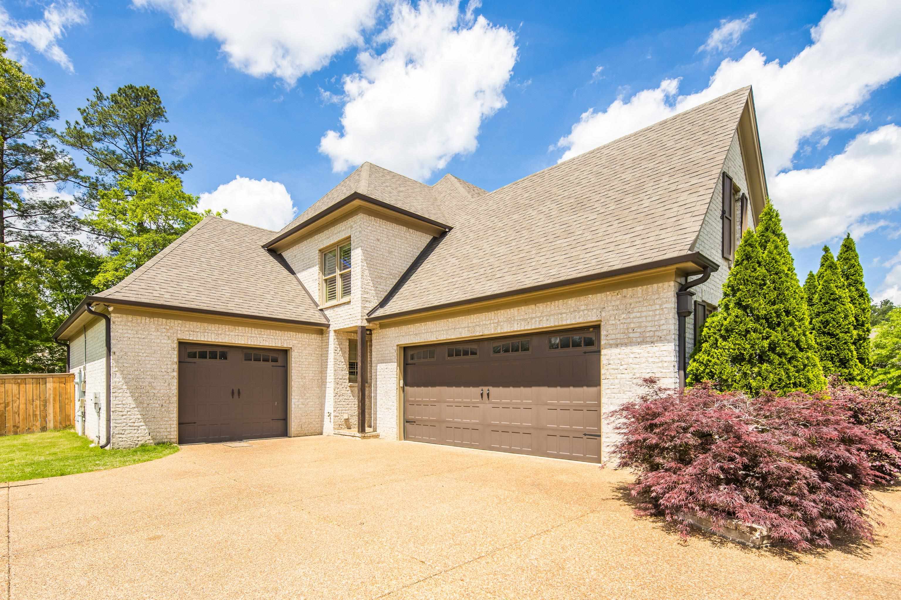 250 Ridgewood Drive Piperton, TN 38017 - Photo 35 of 36 a front view of a house with a yard and garage