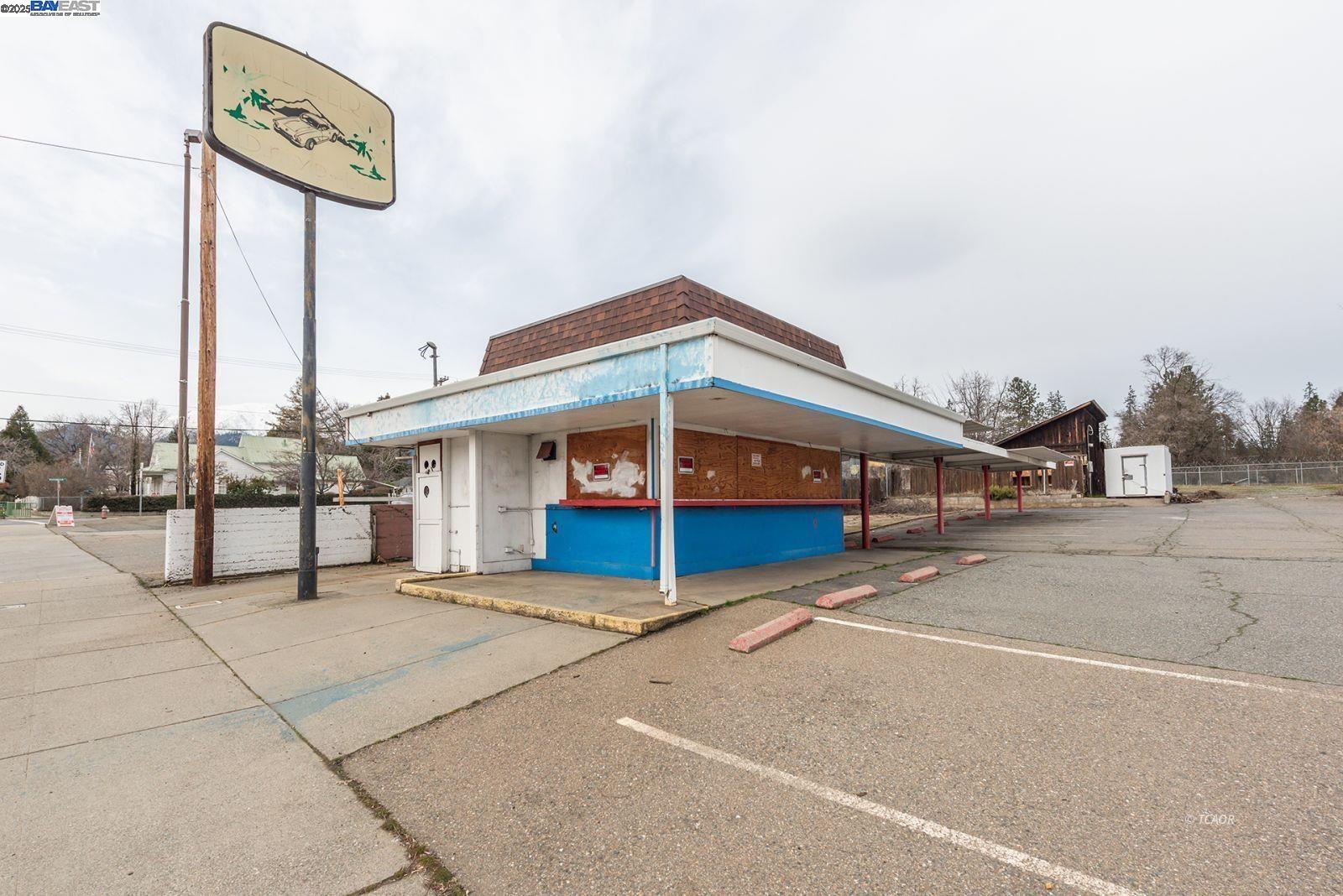 a blue sign that is on the side of a road
