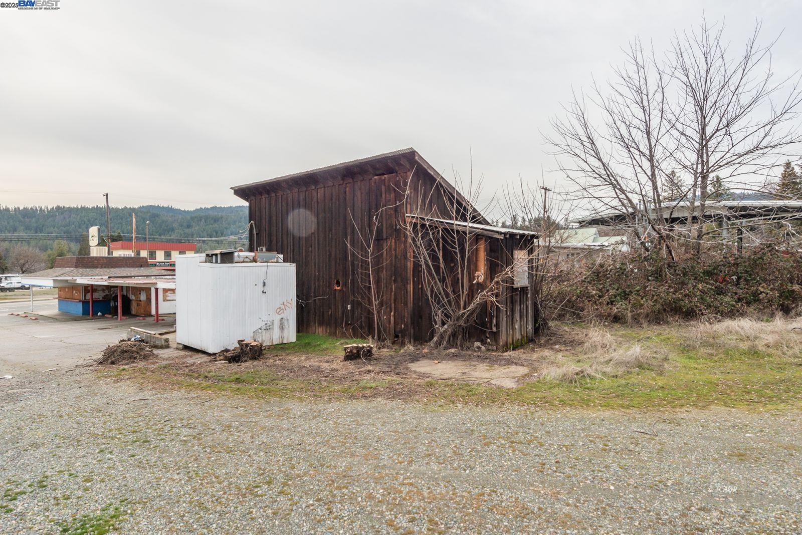 1081 Main Street Weaverville, CA 96093 - Photo 14 of 16 a view of a house with backyard and a tree