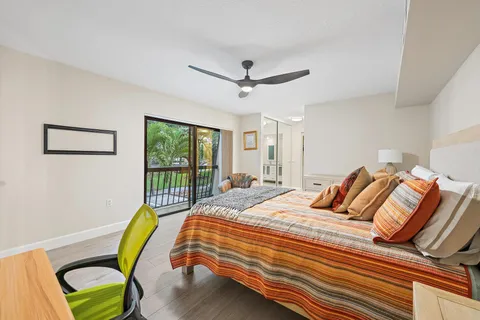 a bedroom with a bed a chair and a couch