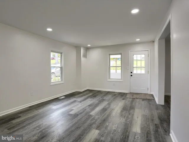 a kitchen with stainless steel appliances a refrigerator sink and microwave