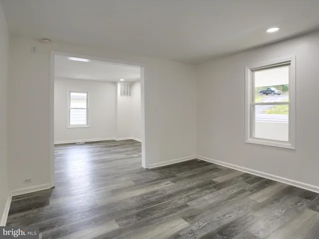 a bathroom with a sink a mirror and a window