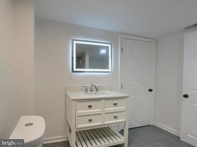 a view of a small space with wooden floor