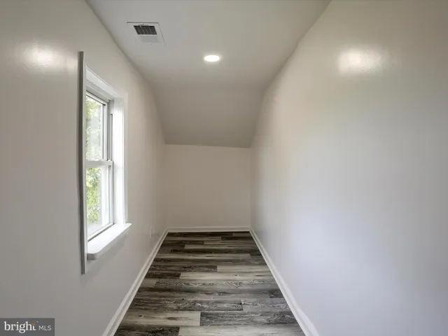 a view of an empty room and window