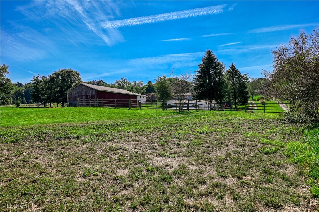685 West Comet Road Clinton, OH 44216 - Photo 37 of 47 View of yard with an outdoor structure and a rural view