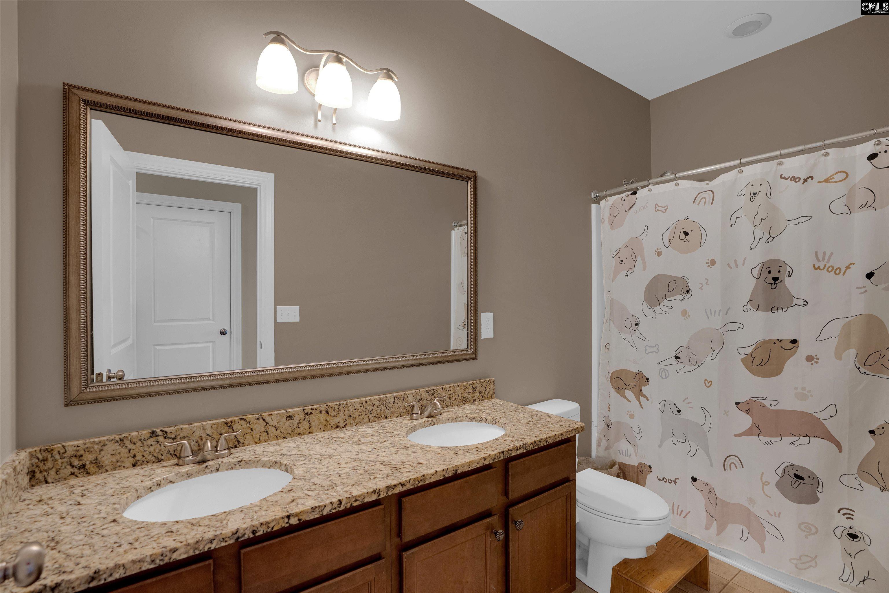 321 Asa Rose Lexington, SC 29072 - Photo 33 of 52 a bathroom with a granite countertop sink and a mirror