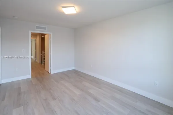 a view of a swimming pool with a chair