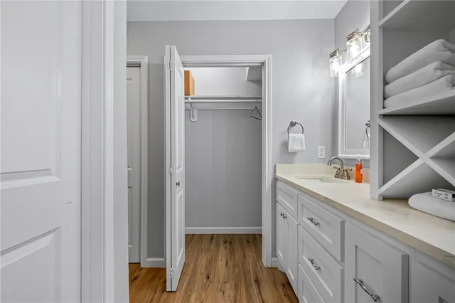 a kitchen with a refrigerator and sink