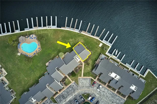 an aerial view of a house swimming pool patio and outdoor seating