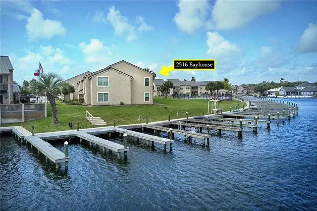 a view of a backyard with sitting area