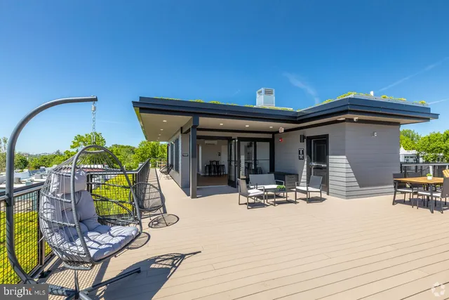 a view of a patio with swimming pool