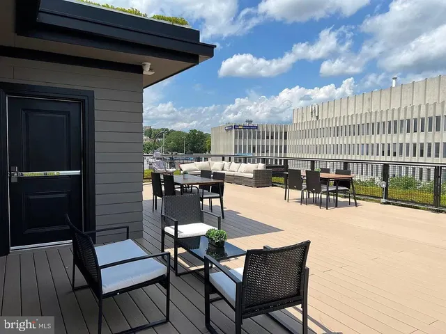 a view of a chairs and table in patio