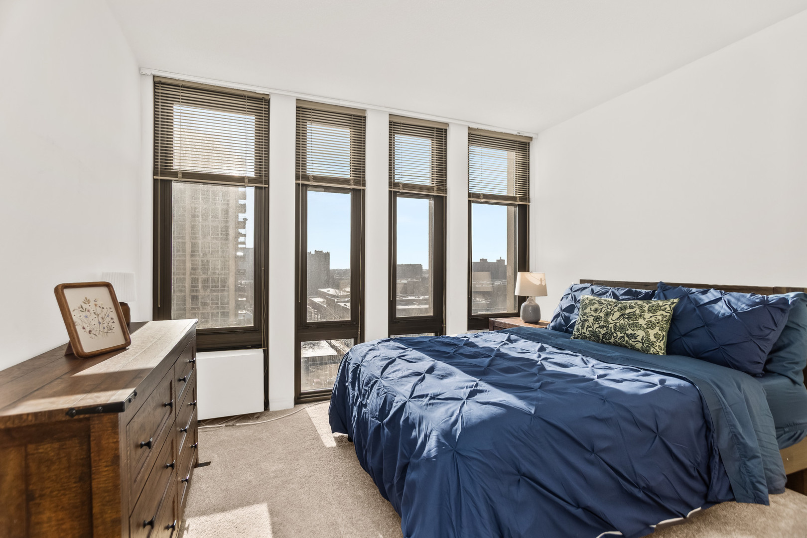 6700 South South Shore Drive, Unit 9D9E Chicago, IL 60649 - Photo 14 of 20 a bedroom with a bed chair and window