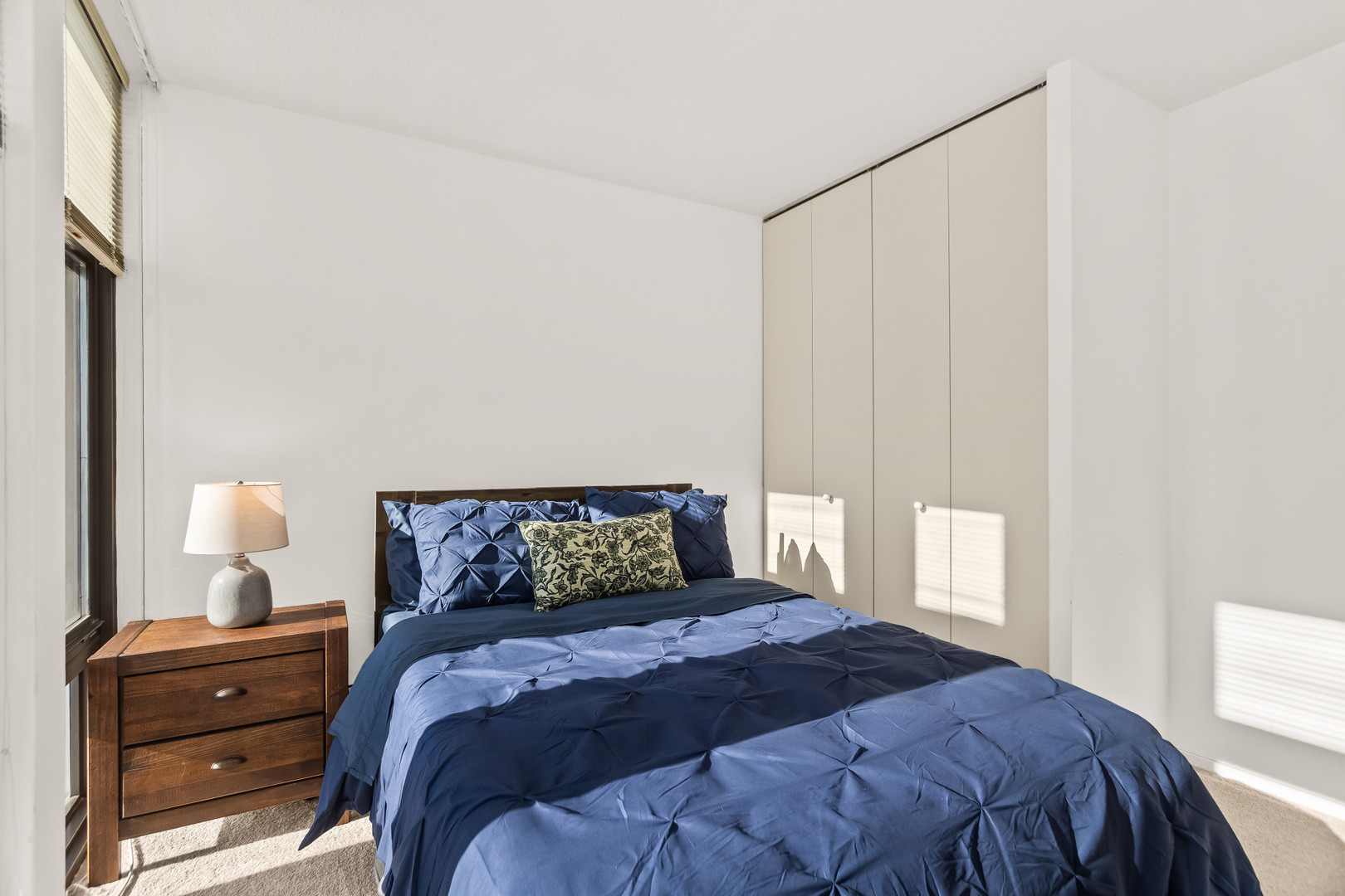 6700 South South Shore Drive, Unit 9D9E Chicago, IL 60649 - Photo 15 of 20 a bedroom with a bed and window