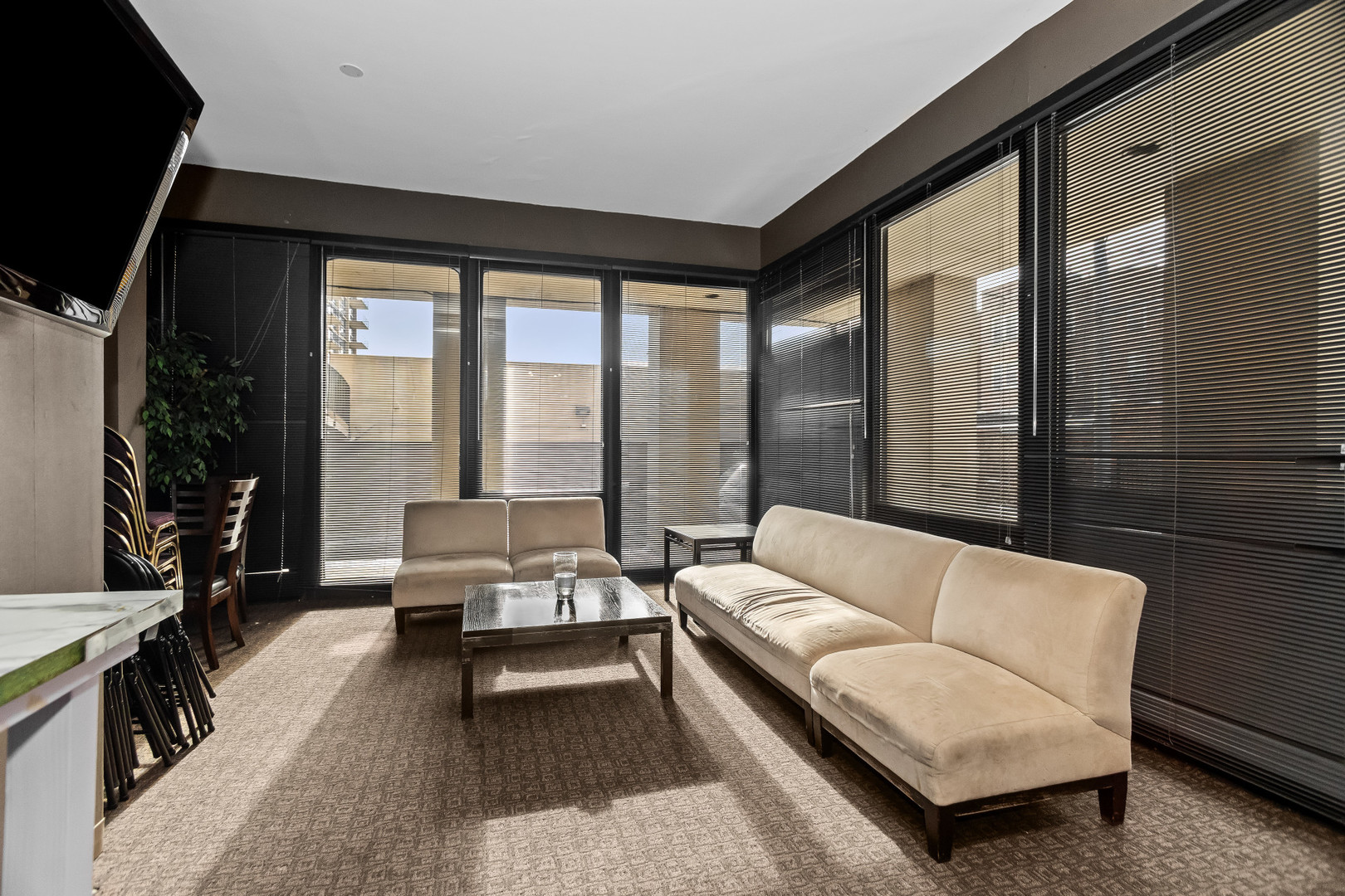 6700 South South Shore Drive, Unit 9D9E Chicago, IL 60649 - Photo 20 of 20 a living room with furniture and a large window