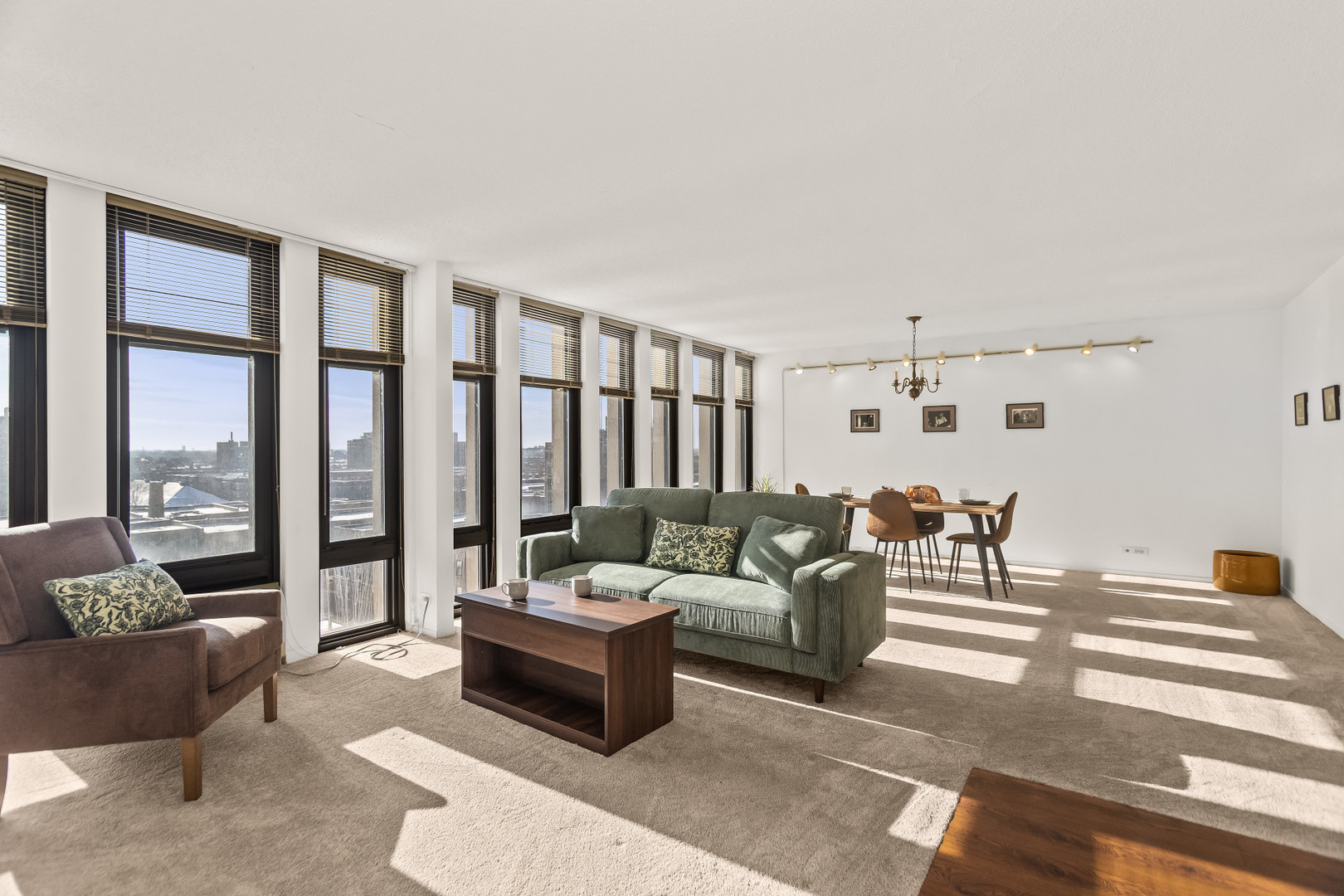 6700 South South Shore Drive, Unit 9D9E Chicago, IL 60649 - Photo 3 of 20 a living room with furniture and a large window