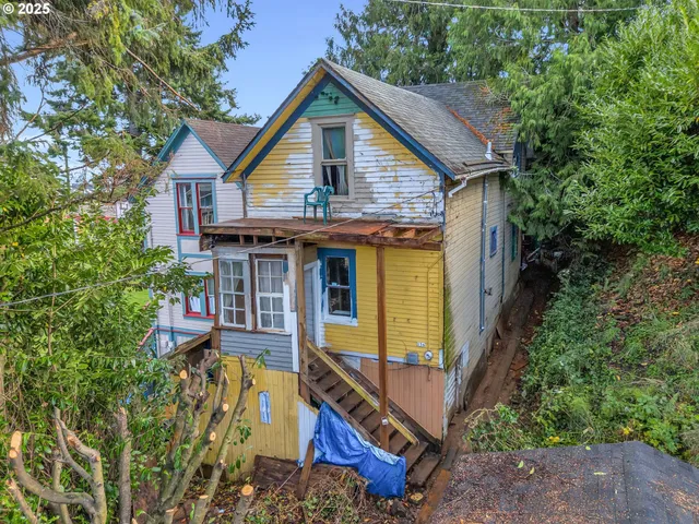 a view of a house with tub and trees around