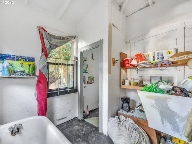 a view of a dining room with furniture a rug and wooden floor