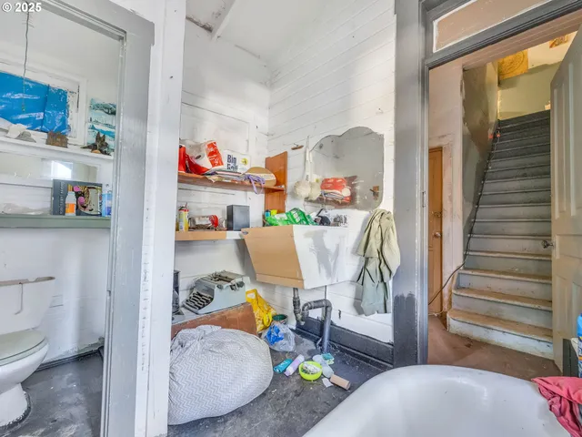 a view of an entryway with wooden floor