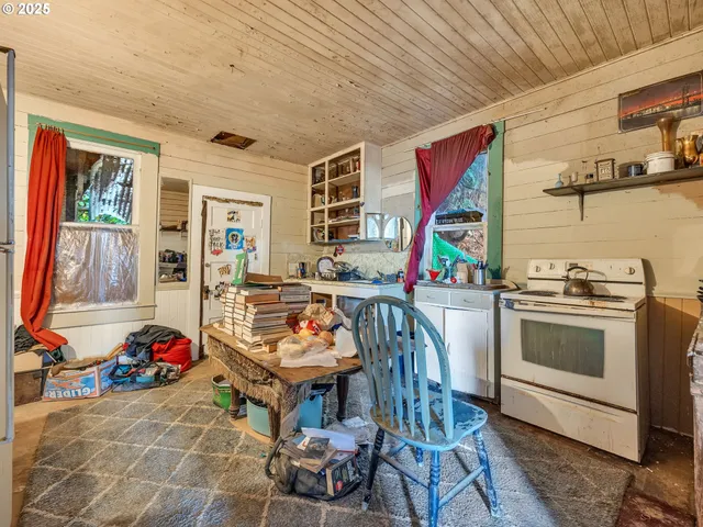 a view of a living room with furniture and wooden floor
