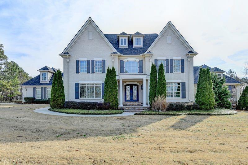 4045 Ridge Road Buford, GA 30519 - Photo 3 of 97 a front view of a house with garden