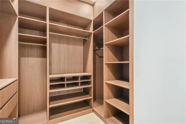 a view of an empty walk in closet