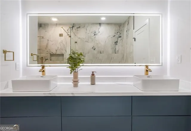 a bathroom with a sink and a mirror