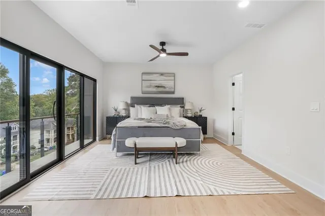 a bedroom with a large bed and a window