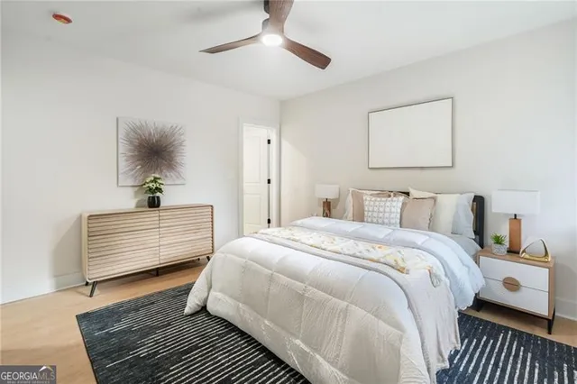 a bedroom with bed and a window