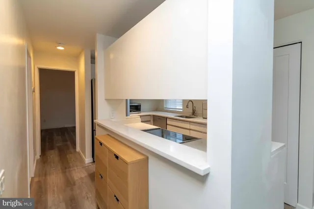 a kitchen with a sink and cabinets