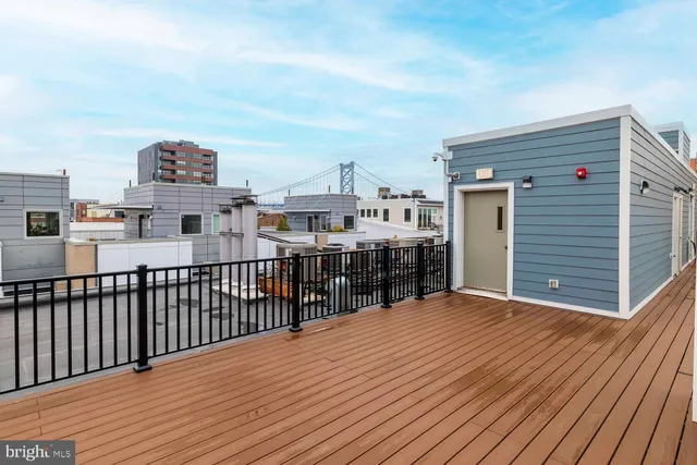 a view of a balcony with wooden floor