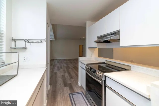 a kitchen that has a stove and a microwave