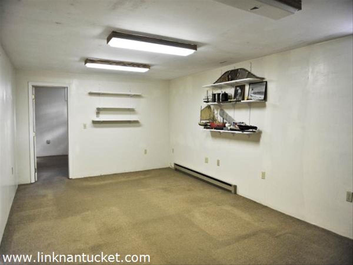 13 Waydale Road Nantucket, MA 02554 - Photo 12 of 14 BASEMENT OFFICE AREA WITH SECOND OFFICE THROUGH DOOR. HALF BATH.