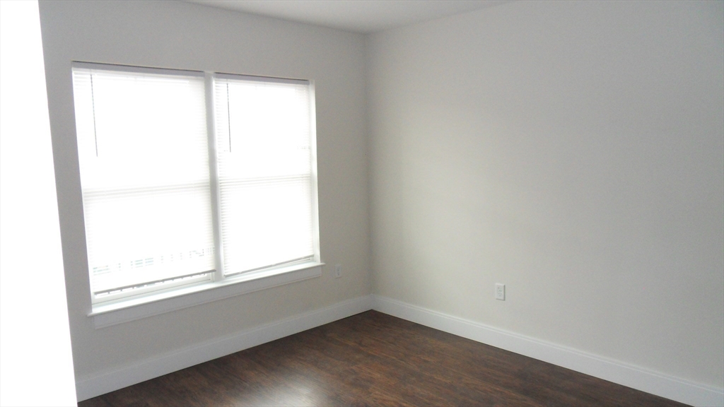 76 Stonley Road, Unit 41 Boston, MA 02130 - Photo 8 of 15 an empty room with a window