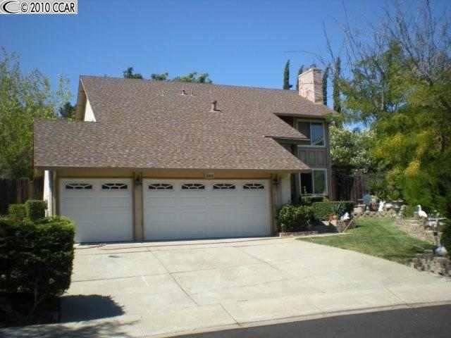 4504 Spring Valley Way Concord, CA 94521 - Photo 1 of 1 a front view of a house with a yard and garage