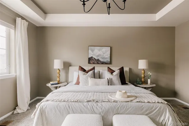 a bedroom with a bed and a night stand