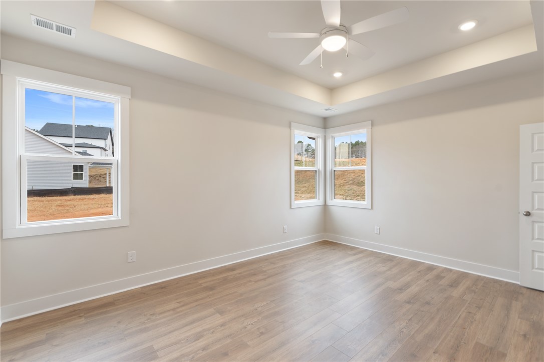 188 Tiger Lily Drive Anderson, SC 29621 - Photo 15 of 25 Depicted photo from another house of the same floorplan. Colors, styles, and options may vary in listed home.ceiling and abundant natural light.