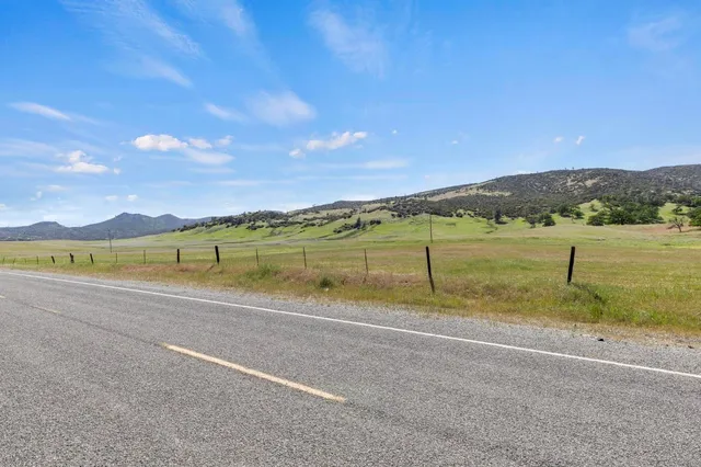 a view of a swimming pool with a yard