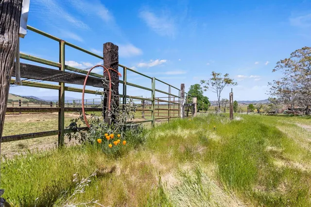 a view of a swimming pool with an outdoor space and seating area