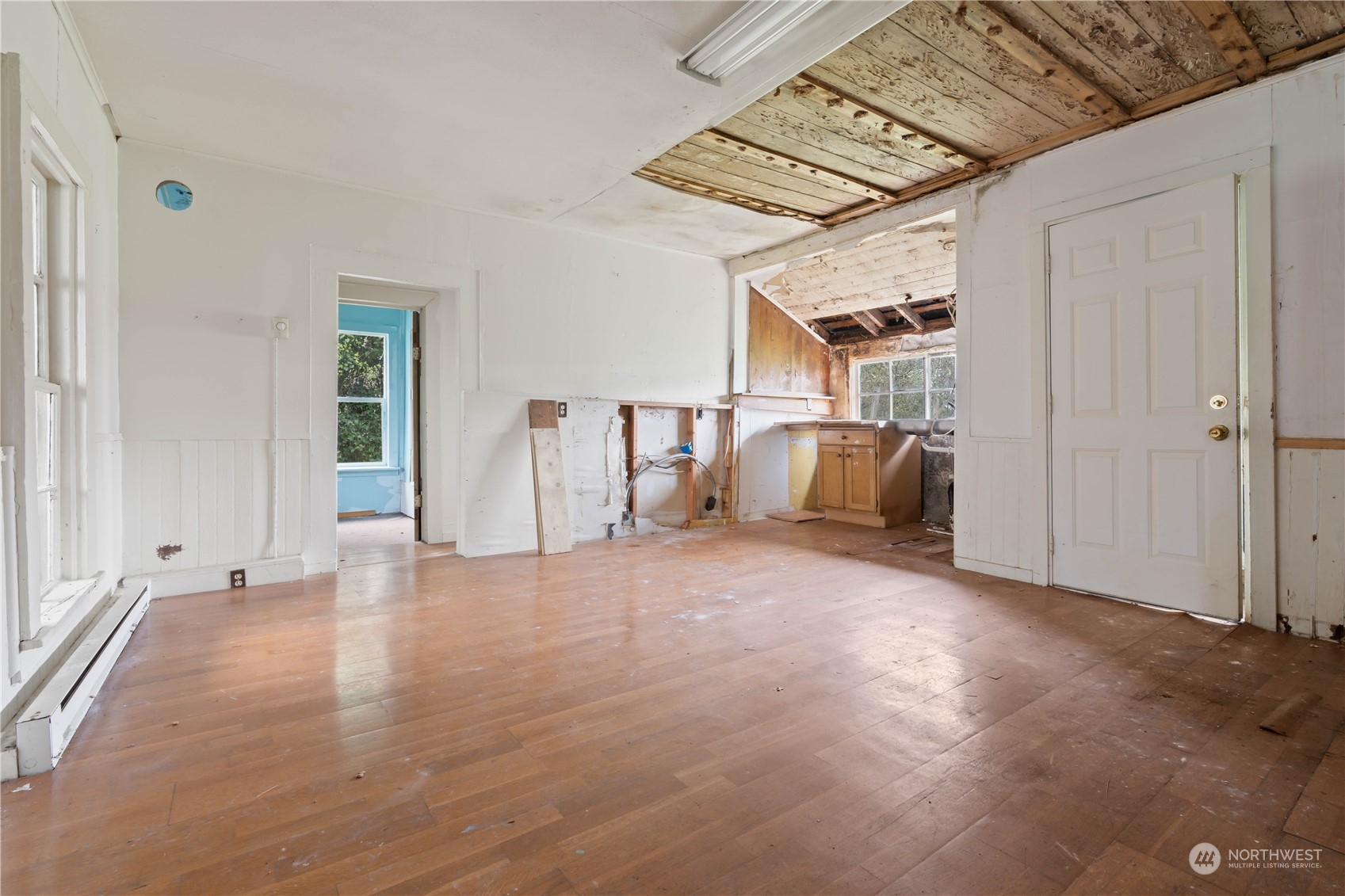 322 4th Street Roy, WA 98580 - Photo 20 of 29 a view of empty room with wooden floor and windows