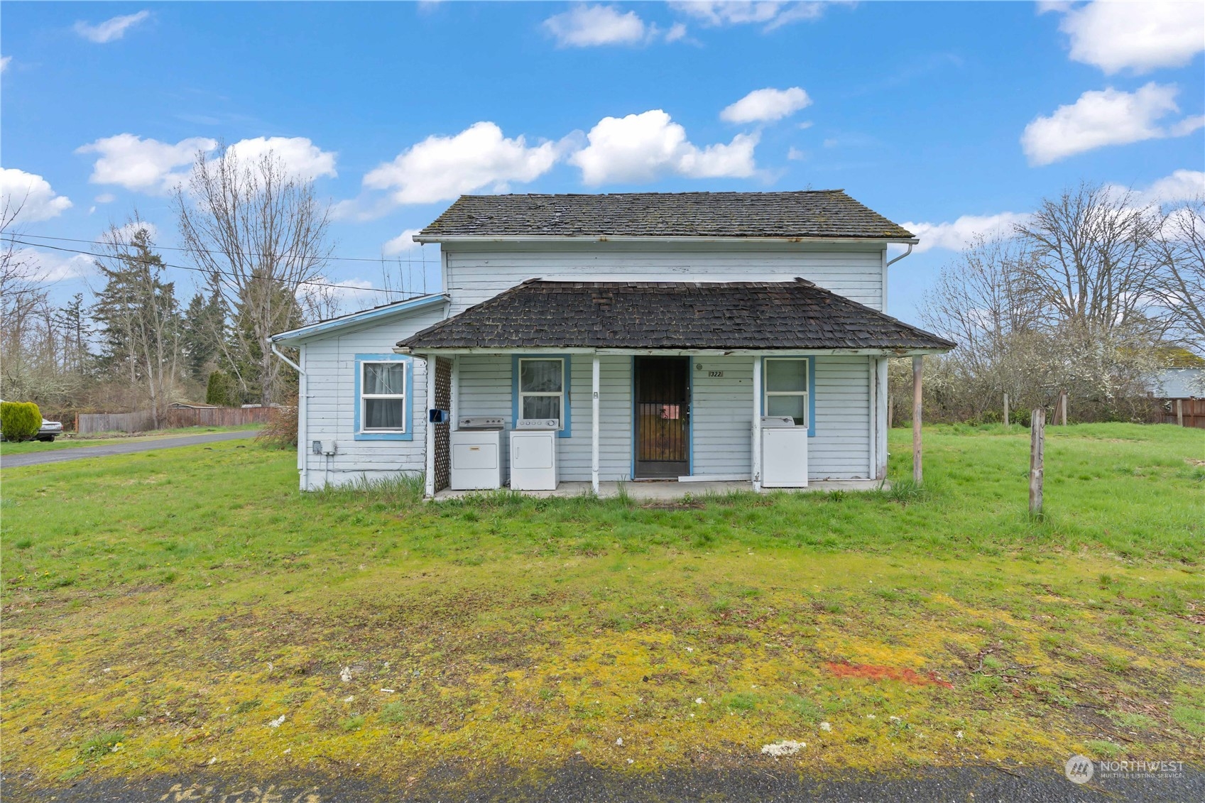 322 4th Street Roy, WA 98580 - Photo 2 of 29 a front view of a house with a yard