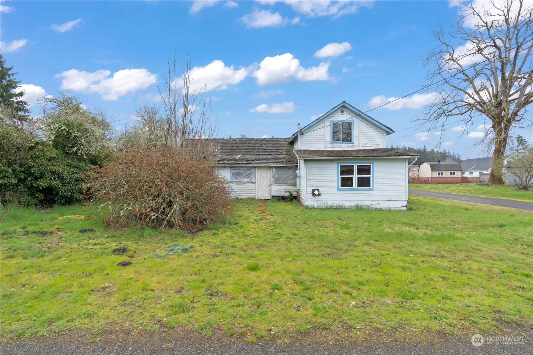 322 4th Street Roy, WA 98580 - Photo 24 of 29 a front view of a house with a yard