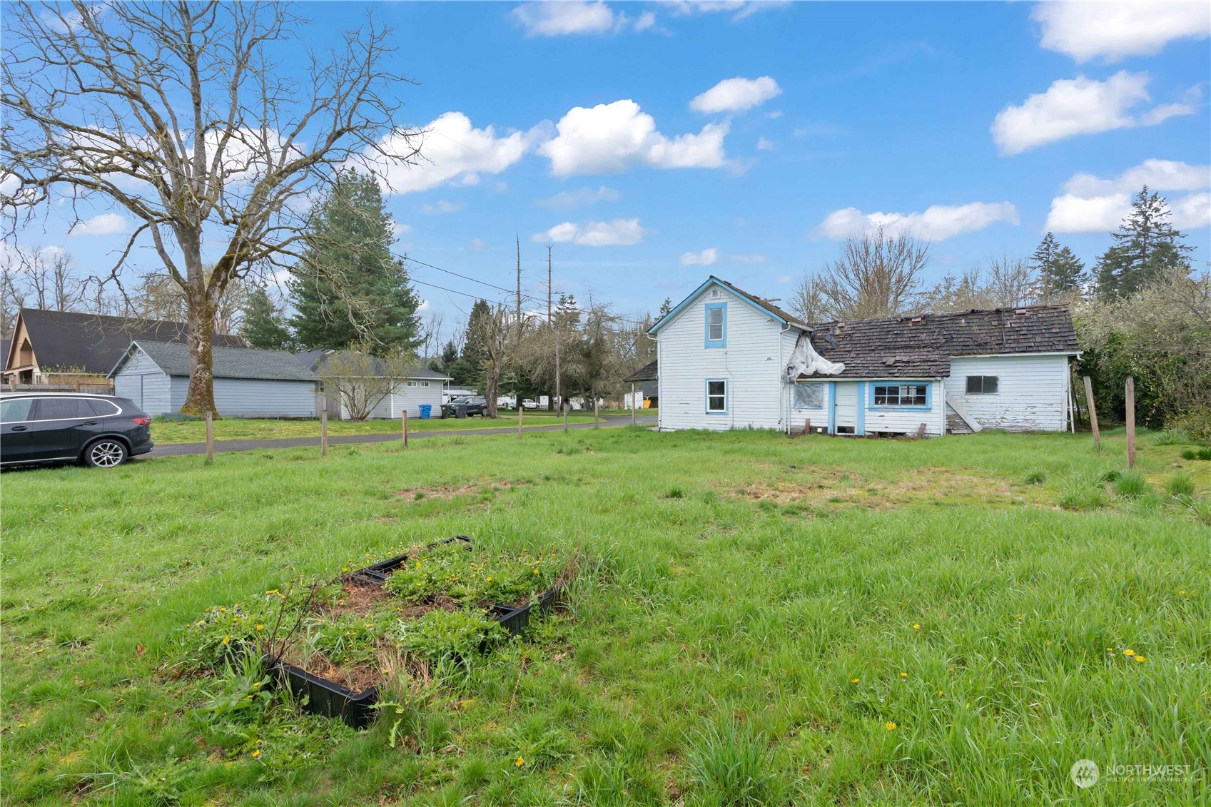 322 4th Street Roy, WA 98580 - Photo 29 of 29 a view of a house with a yard