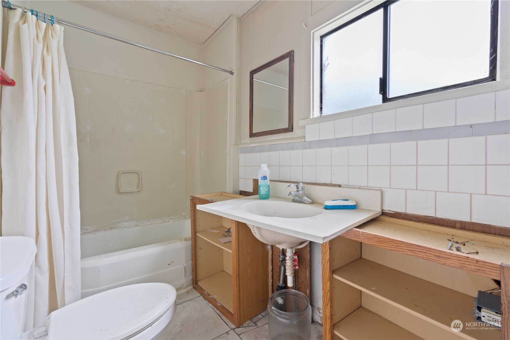 322 4th Street Roy, WA 98580 - Photo 9 of 29 a bathroom with a sink toilet and shower