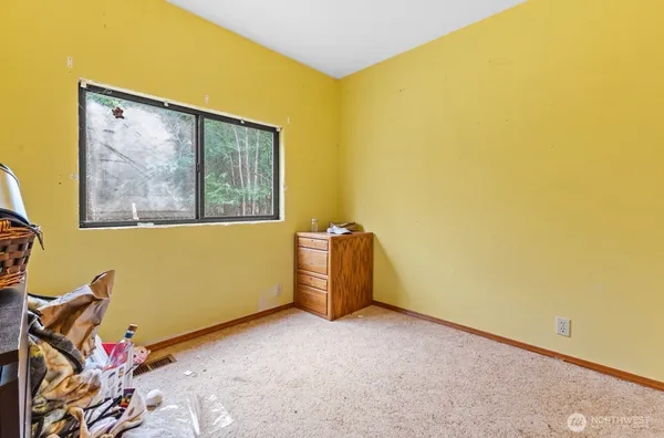 a view of a room with blue walls and a window