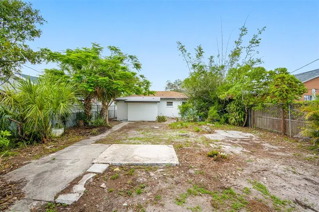 a backyard of a house with lots of green space