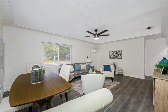 a living room with furniture and a window